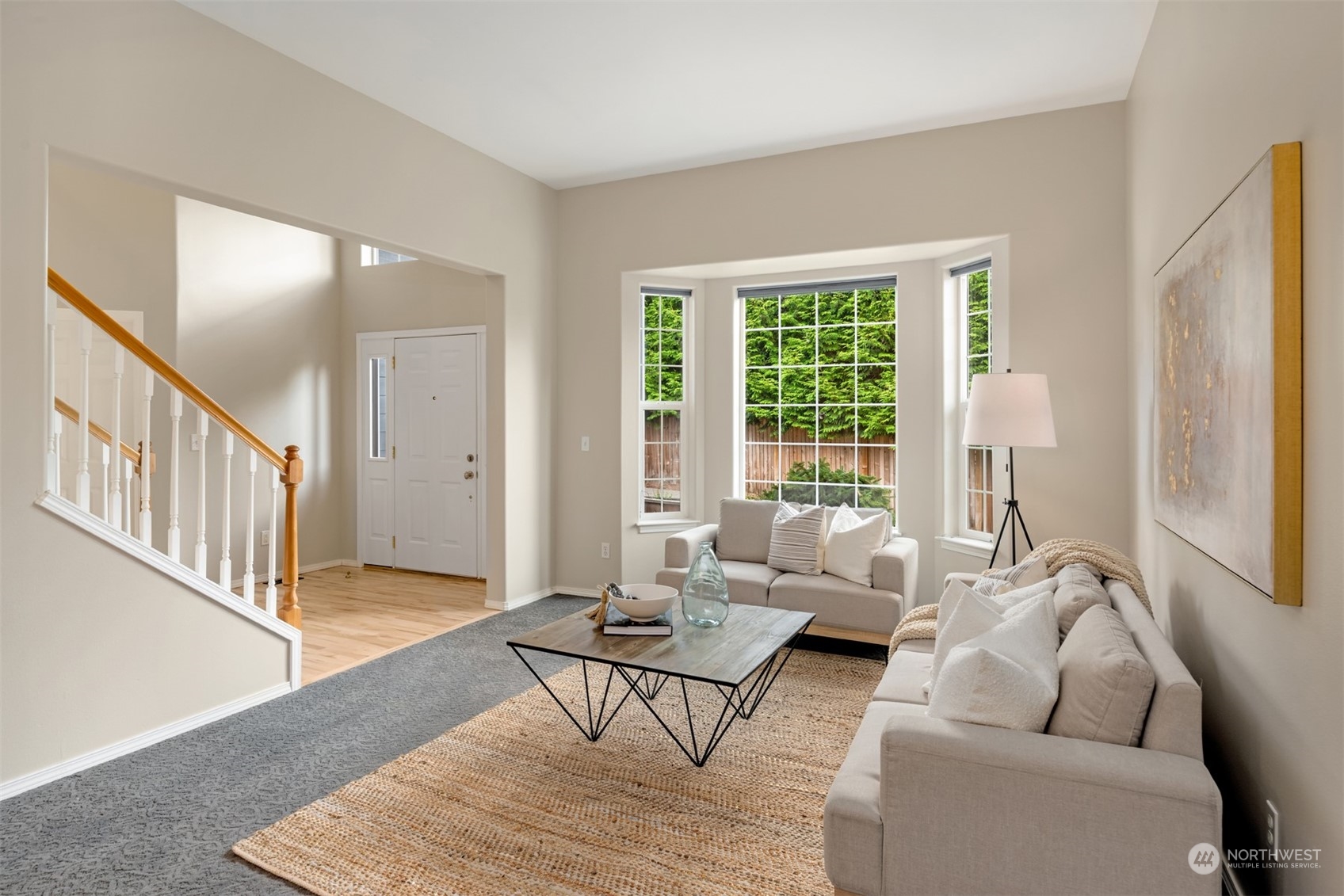 23021 21st Avenue Southeast Bothell, WA 98021 - Photo 3 of 29 a living room with furniture and a table with wooden floor