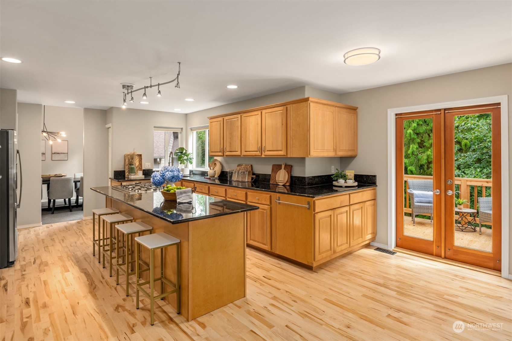 23021 21st Avenue Southeast Bothell, WA 98021 - Photo 7 of 29 a kitchen with stainless steel appliances granite countertop a stove a sink dishwasher and a refrigerator with wooden floor