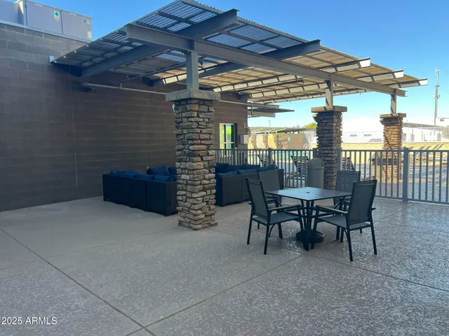 a view of a chairs and table in the patio