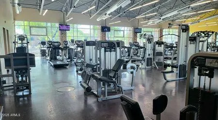 a view of a room with lots of gym equipment