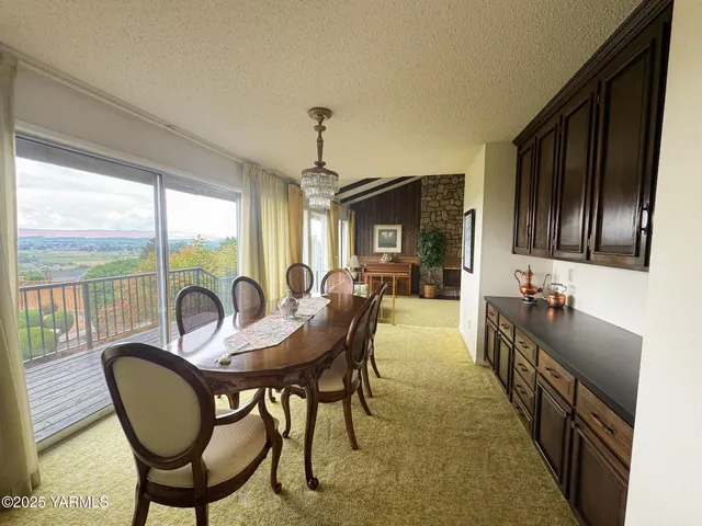 a view of a dining room with furniture window and outside view