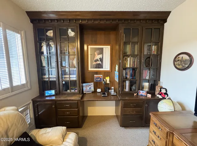 a living room with furniture and window