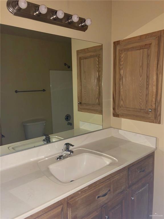 804 North Taylor Road, Unit 29 Mission, TX 78572 - Photo 21 of 27 a bathroom with a sink and a mirror