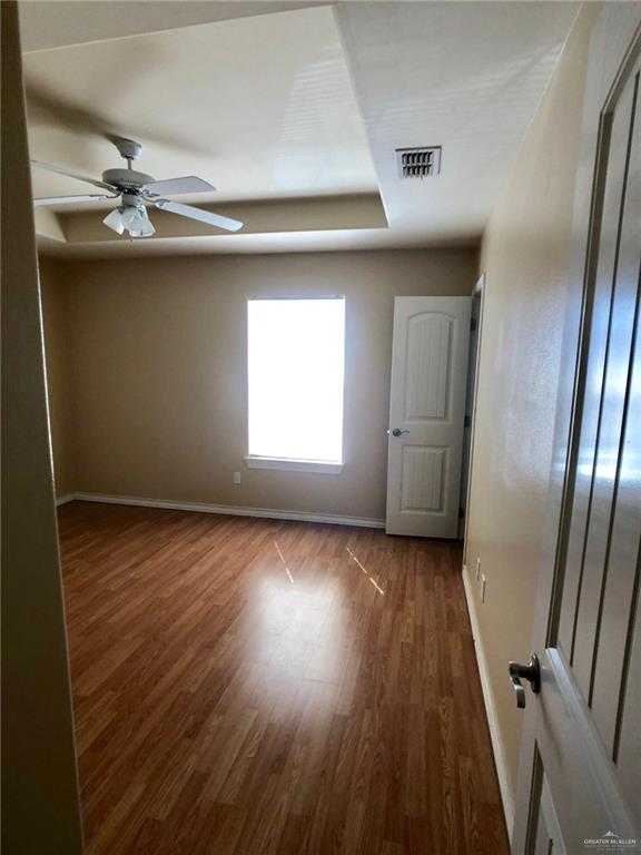 804 North Taylor Road, Unit 29 Mission, TX 78572 - Photo 22 of 27 a view of empty room with wooden floor and window