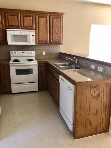 a kitchen with a stove and a microwave