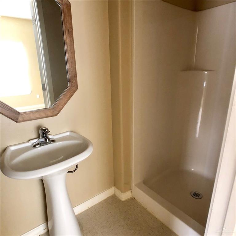 804 North Taylor Road, Unit 29 Mission, TX 78572 - Photo 10 of 27 a bathroom with a sink and a mirror