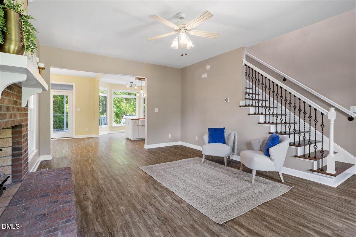 7505 Penny Road Raleigh, NC 27606 - Photo 11 of 35 a living room with furniture and wooden floor