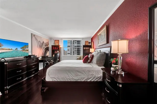 a bedroom with a bed and dresser