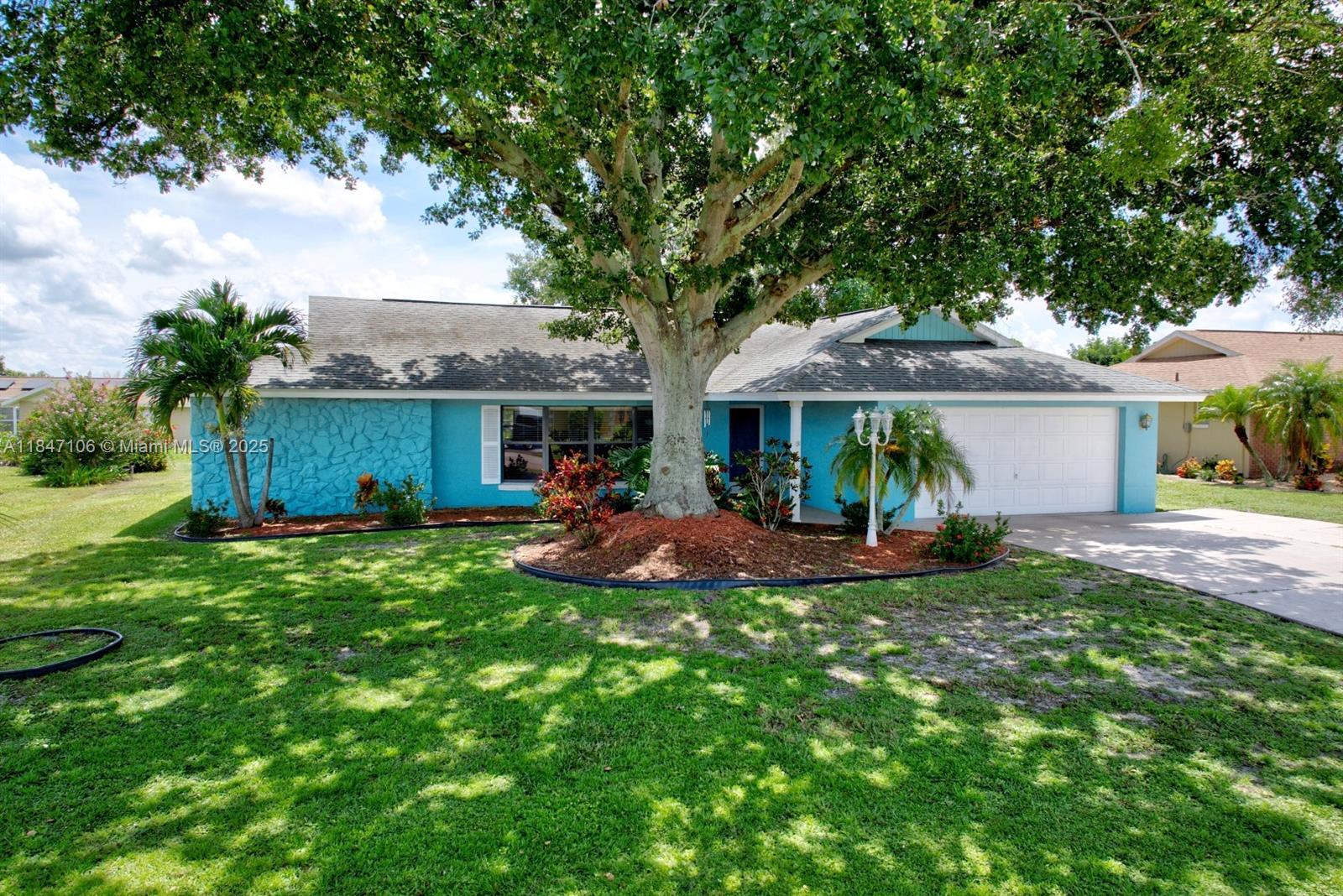 a view of a house with a yard porch and sitting area