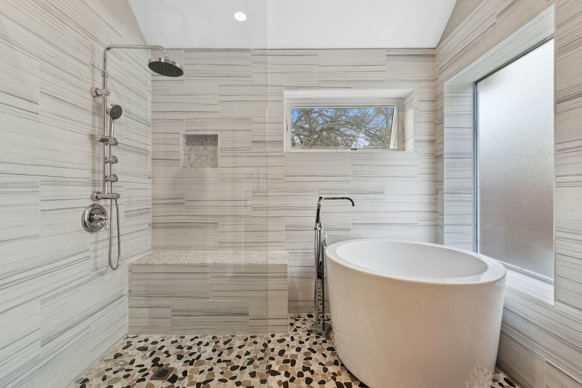 320 El Socorro Lane Austin, TX 78732 - Photo 6 of 40 a bathroom with a bathtub and shower