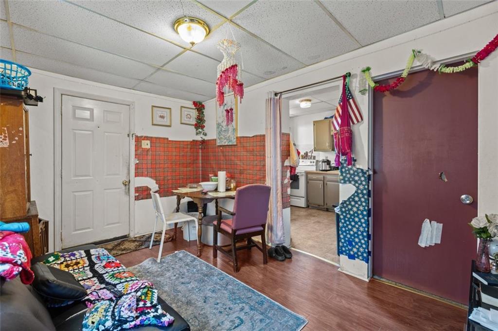 107 Overbrook Boulevard Pittsburgh, PA 15210 - Photo 15 of 33 a living room with furniture and a chandelier