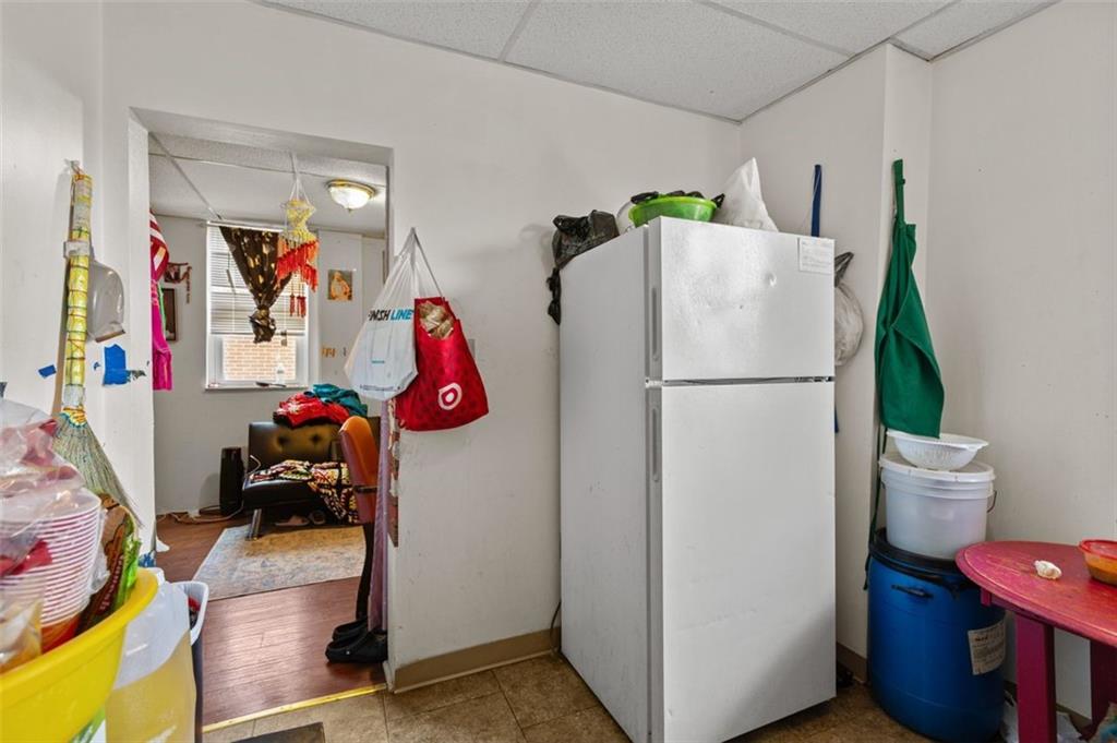 107 Overbrook Boulevard Pittsburgh, PA 15210 - Photo 17 of 33 a view of storage and utility room with refrigerator and toys