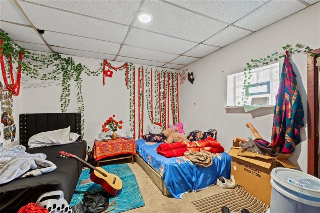 107 Overbrook Boulevard Pittsburgh, PA 15210 - Photo 19 of 33 a living room with lots of storage and a table
