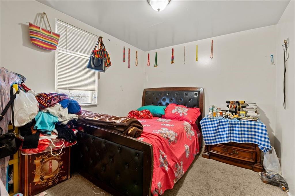 107 Overbrook Boulevard Pittsburgh, PA 15210 - Photo 20 of 33 a bedroom with a bed and a window