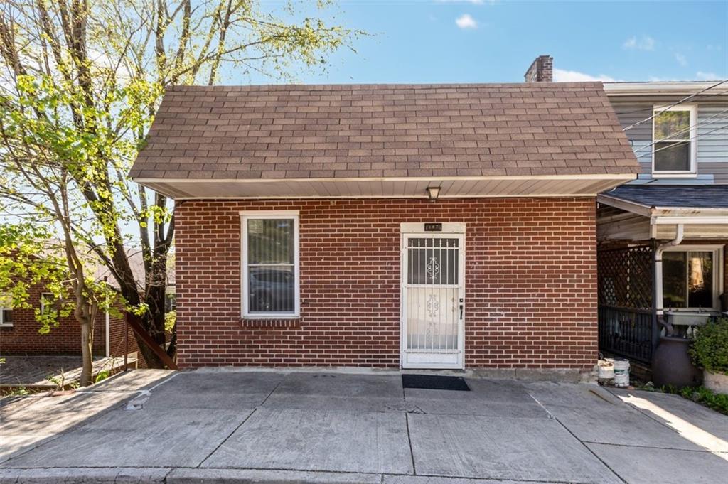 107 Overbrook Boulevard Pittsburgh, PA 15210 - Photo 2 of 33 a front view of a house with garage