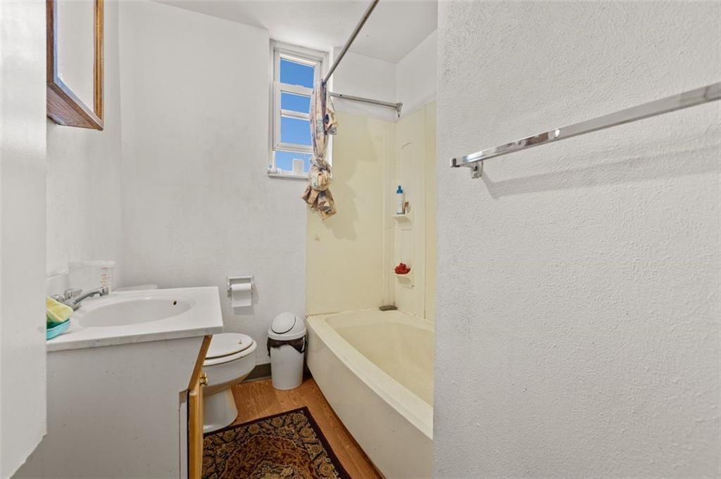 107 Overbrook Boulevard Pittsburgh, PA 15210 - Photo 29 of 33 a bathroom with a bathtub and a shower