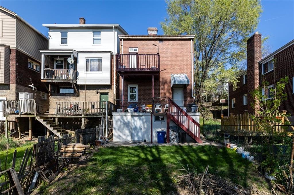 107 Overbrook Boulevard Pittsburgh, PA 15210 - Photo 3 of 33 a view of multiple house with a patio and a yard