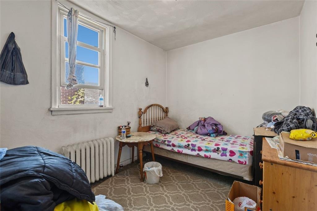 107 Overbrook Boulevard Pittsburgh, PA 15210 - Photo 33 of 33 a bedroom with a bed and a window