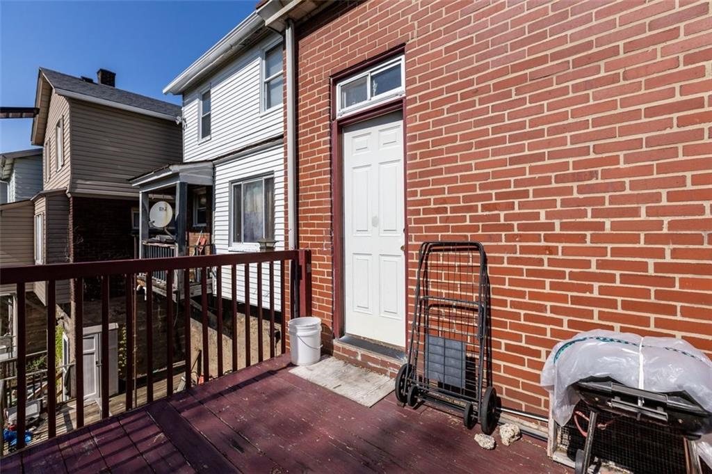 107 Overbrook Boulevard Pittsburgh, PA 15210 - Photo 5 of 33 a view of a house with a brick wall