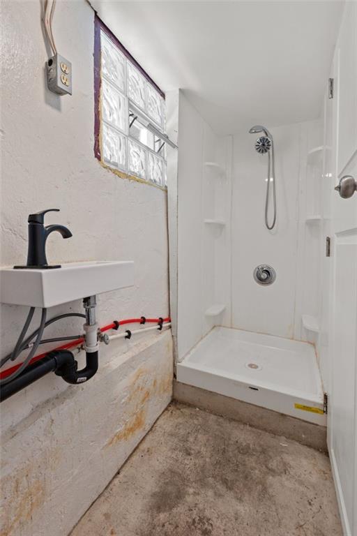 107 Overbrook Boulevard Pittsburgh, PA 15210 - Photo 10 of 33 a bathroom with a tub and a shower