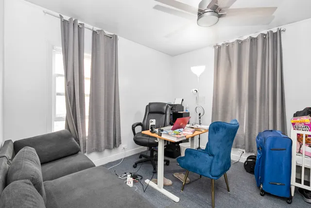 a work room with furniture and a window