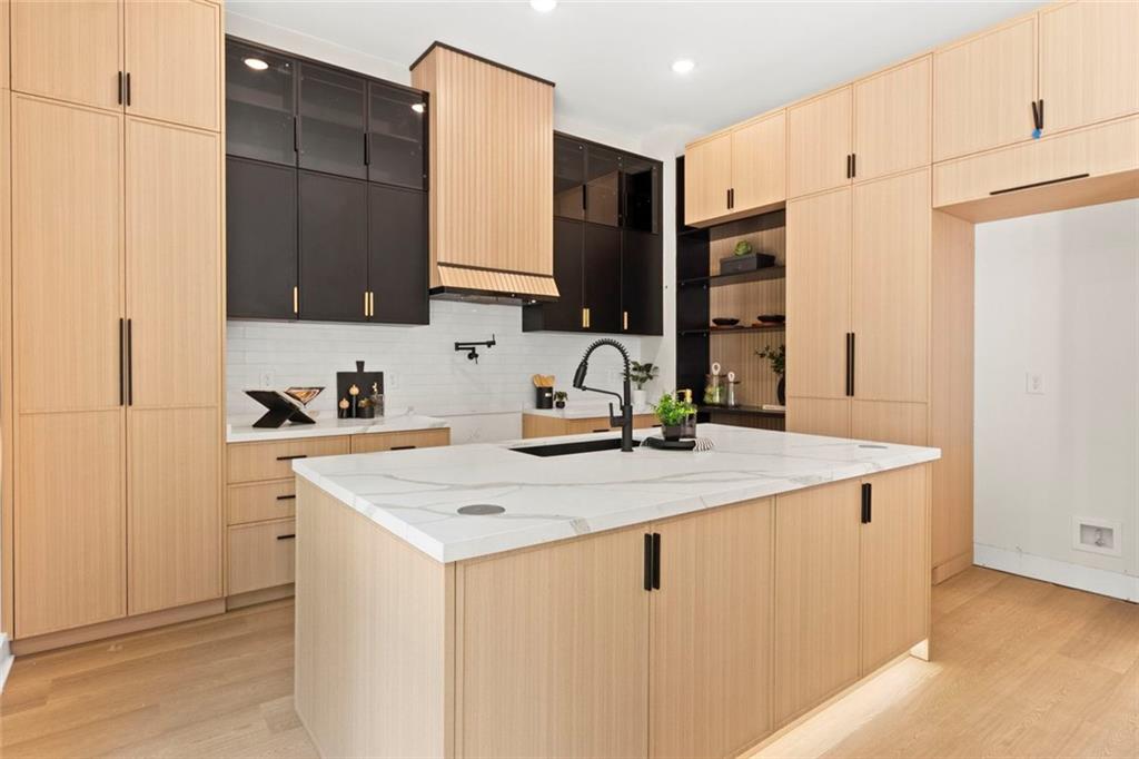 7066 Bells Way Fairburn, GA 30213 - Photo 23 of 64 a kitchen with stainless steel appliances a sink and a refrigerator