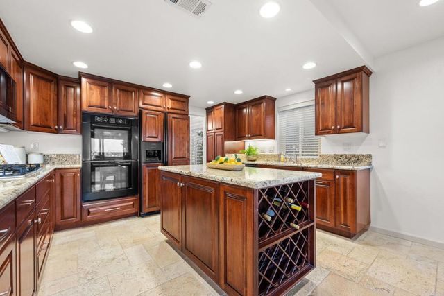 a kitchen with a stove and a sink