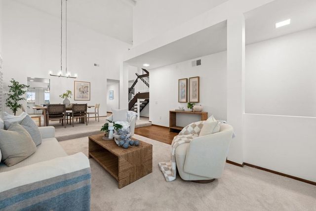 a view of a livingroom with furniture and window