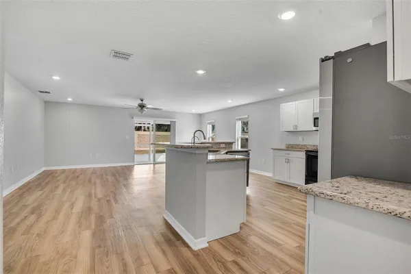 a kitchen with a sink and cabinets