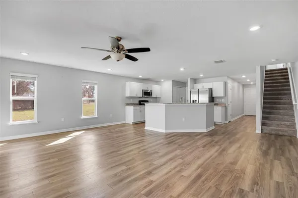 a view of a kitchen with a sink and a window