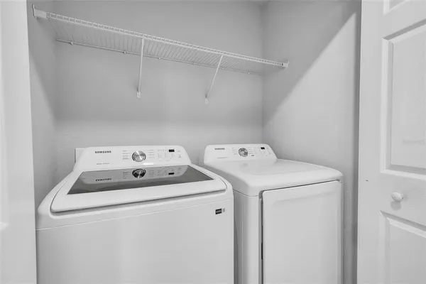 a utility room with dryer and washer