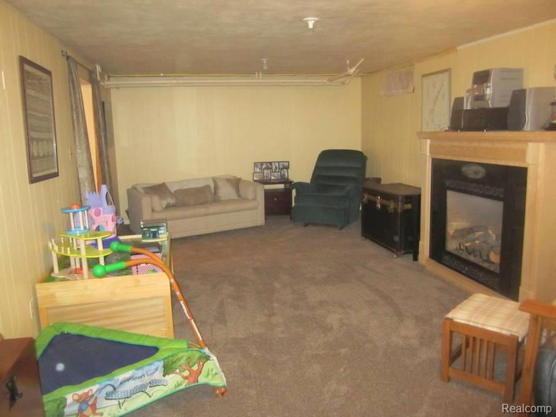 304 Mission Road Sault Ste. Marie, MI 49783 - Photo 22 of 25 basement family room 2.jpg