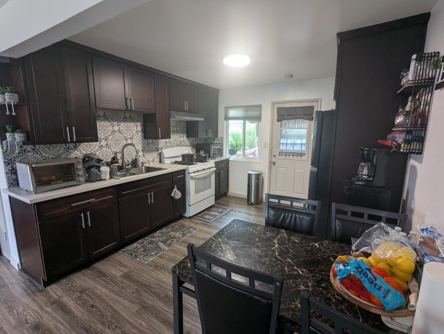 250 Schafer Road Hayward, CA 94544 - Photo 13 of 21 a kitchen with stainless steel appliances granite countertop a sink stove and cabinets
