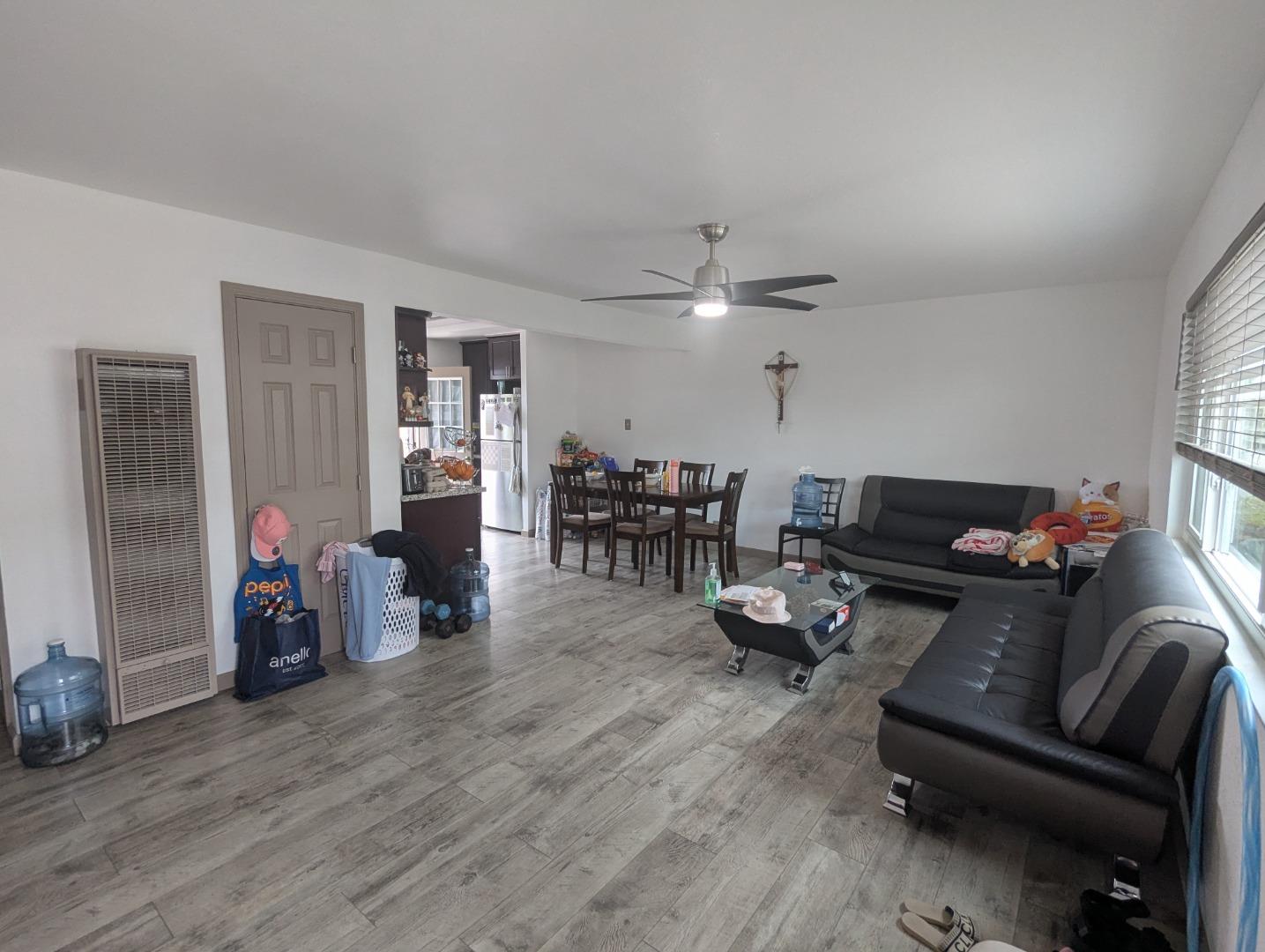 250 Schafer Road Hayward, CA 94544 - Photo 3 of 21 a living room with furniture and wooden floor