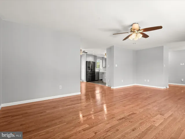 a kitchen with granite countertop a sink stainless steel appliances and cabinets