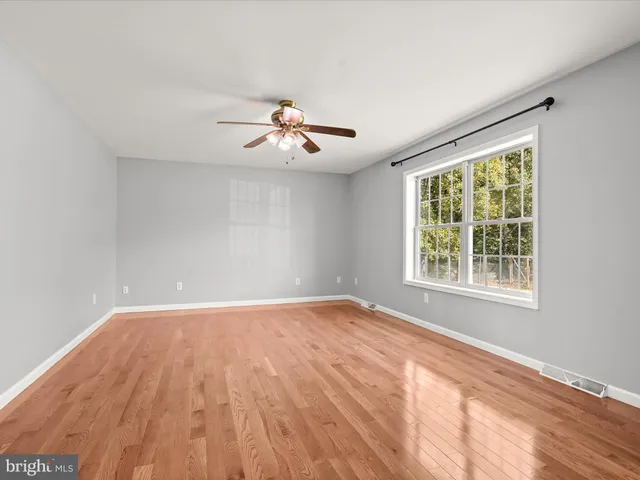 a view of deck with a floor to ceiling window with wooden floor