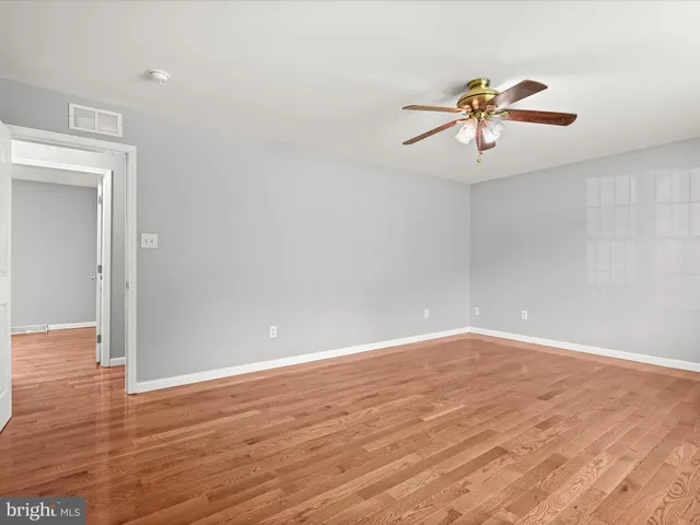 a view of a field with an trees in the background