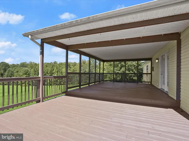 an aerial view of a golf course with parking space