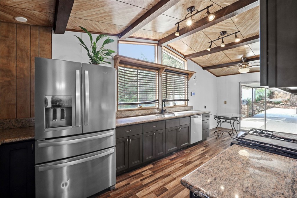 33743 Plowshare Road Wildomar, CA 92595 - Photo 1 of 1 a kitchen with stainless steel appliances granite countertop a sink a stove and a refrigerator