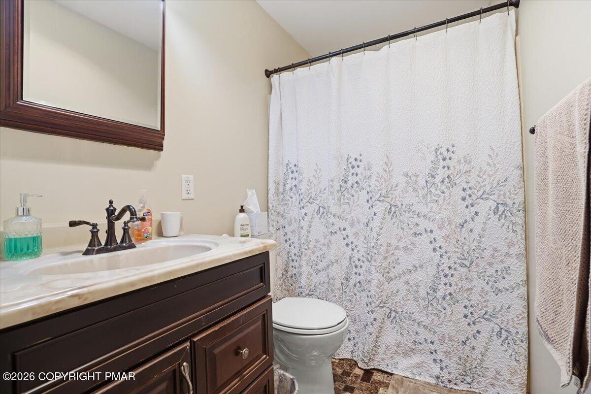 1517 Deer Run East Bushkill, PA 18324 - Photo 27 of 42 a bathroom with a sink and a toilet
