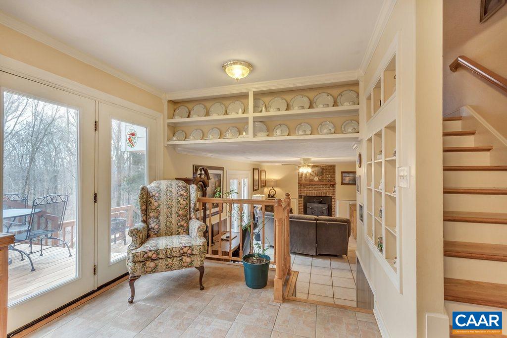 2406 Wakefield Road Charlottesville, VA 22901 - Photo 14 of 31 a view of a entryway door with living room and furniture