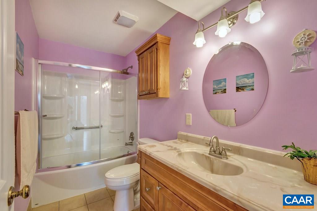 2406 Wakefield Road Charlottesville, VA 22901 - Photo 16 of 31 a bathroom with a sink mirror toilet and shower