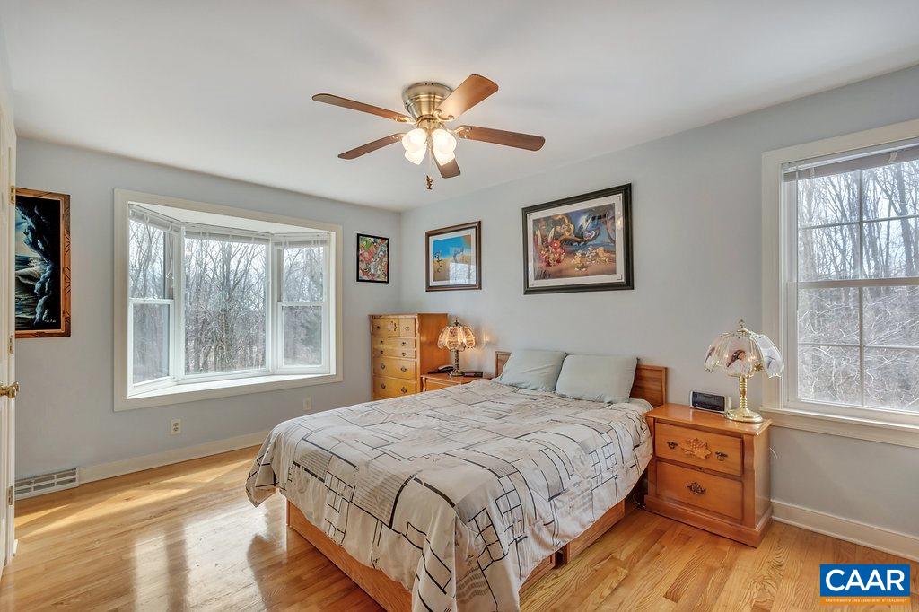 2406 Wakefield Road Charlottesville, VA 22901 - Photo 17 of 31 a bedroom with a bed and a window