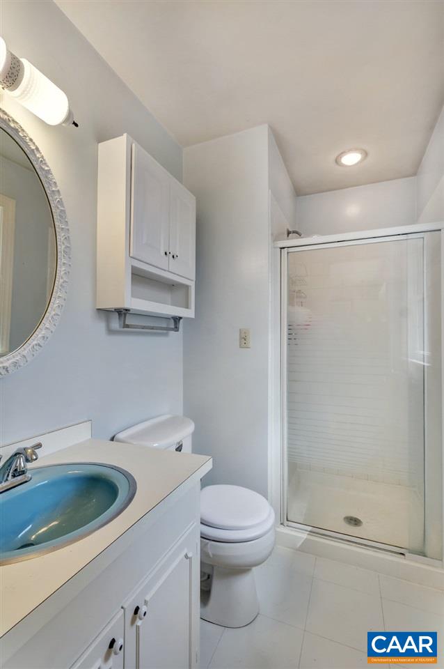 2406 Wakefield Road Charlottesville, VA 22901 - Photo 21 of 31 a bathroom with a sink toilet and shower