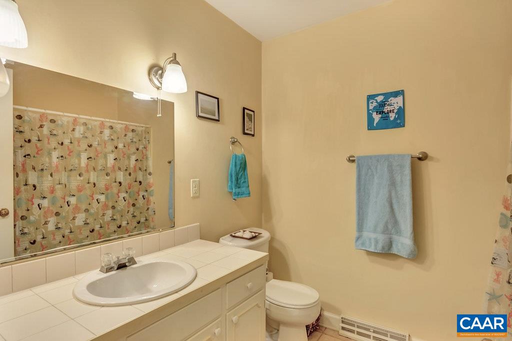 2406 Wakefield Road Charlottesville, VA 22901 - Photo 22 of 31 a bathroom with a sink and a mirror