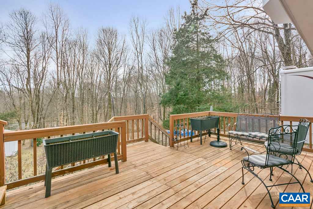 2406 Wakefield Road Charlottesville, VA 22901 - Photo 27 of 31 a view of a chairs and table on the wooden deck