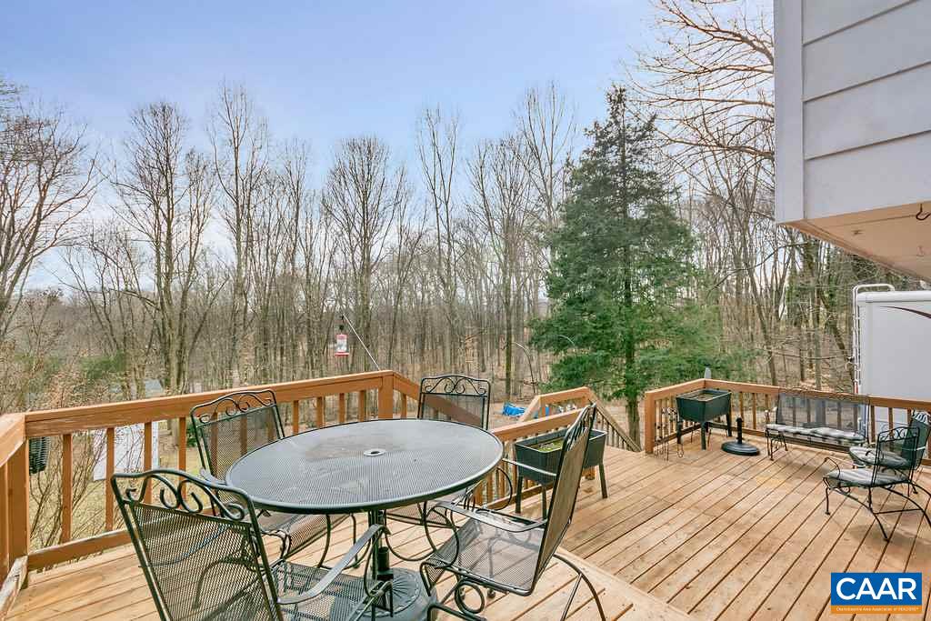2406 Wakefield Road Charlottesville, VA 22901 - Photo 3 of 31 a view of a chairs and table on the deck