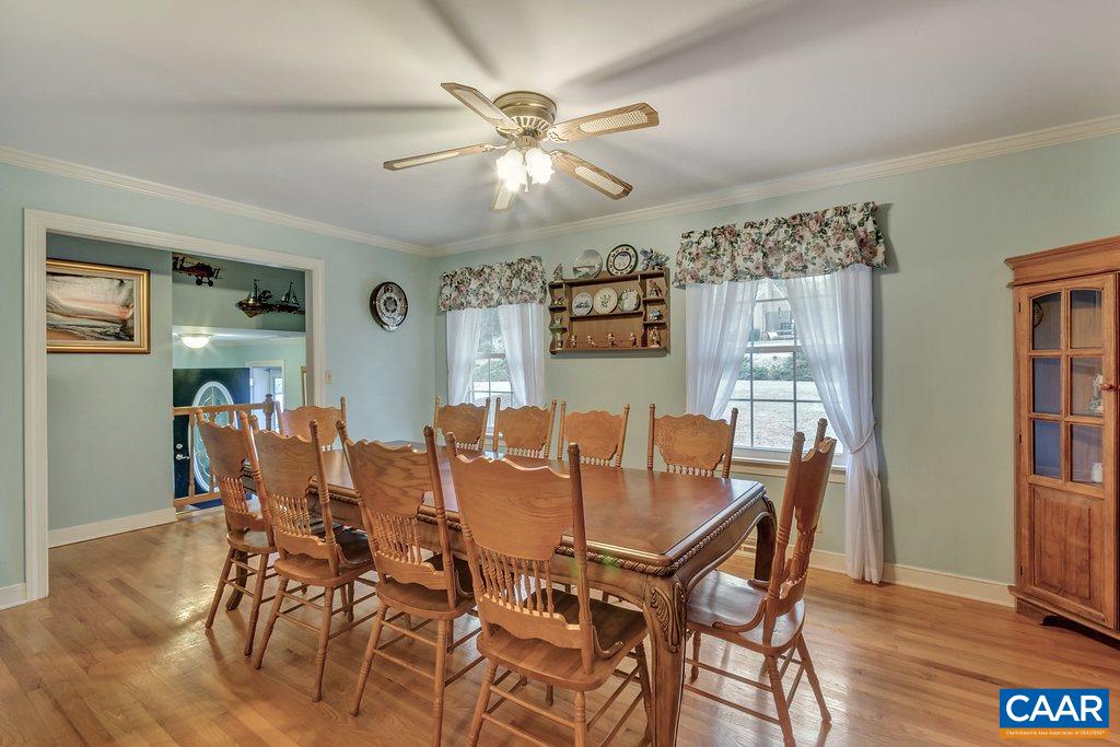 2406 Wakefield Road Charlottesville, VA 22901 - Photo 7 of 31 a view of a dining room with furniture and wooden floor