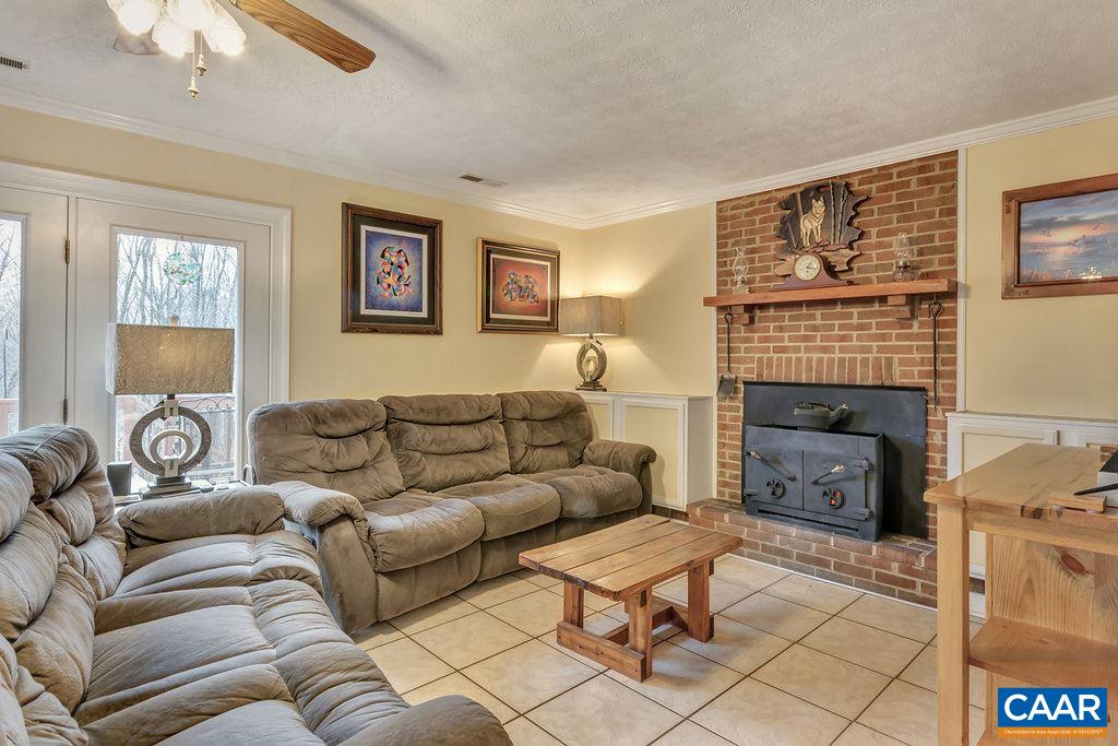 2406 Wakefield Road Charlottesville, VA 22901 - Photo 8 of 31 a living room with furniture and a fireplace
