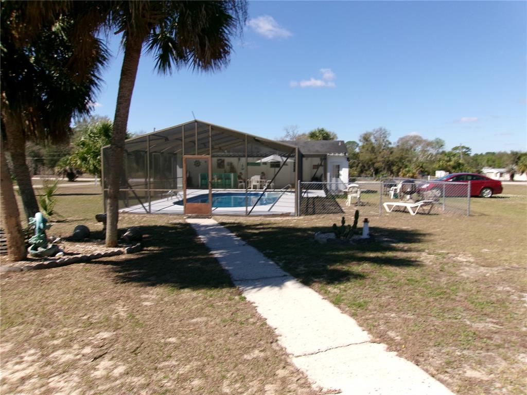 12525 Southeast 83rd Terrace Belleview, FL 34420 - Photo 13 of 47 a view of a street with cars